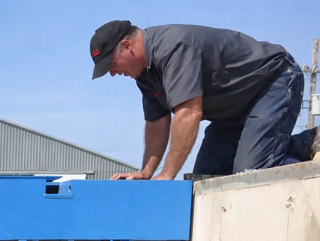 Factory technician carrying out load cell diagnostics and electrical scale repair